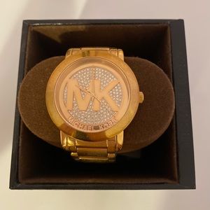 Michael Kors stainless steel watch in a gold color